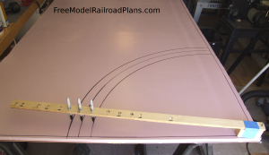 Free model railroad plans, O gauge, layout, spare bedroom, roadbed, marking curves