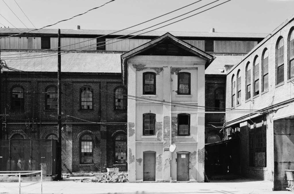 Southern Pacific Sacramento Shops Privy, south elevation, with Planing Mill in background and Car Shop No. 3 at right. Jet Lowe, photographer

